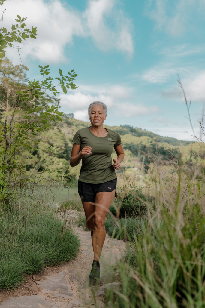 woman over 40 jogging in nature cardio