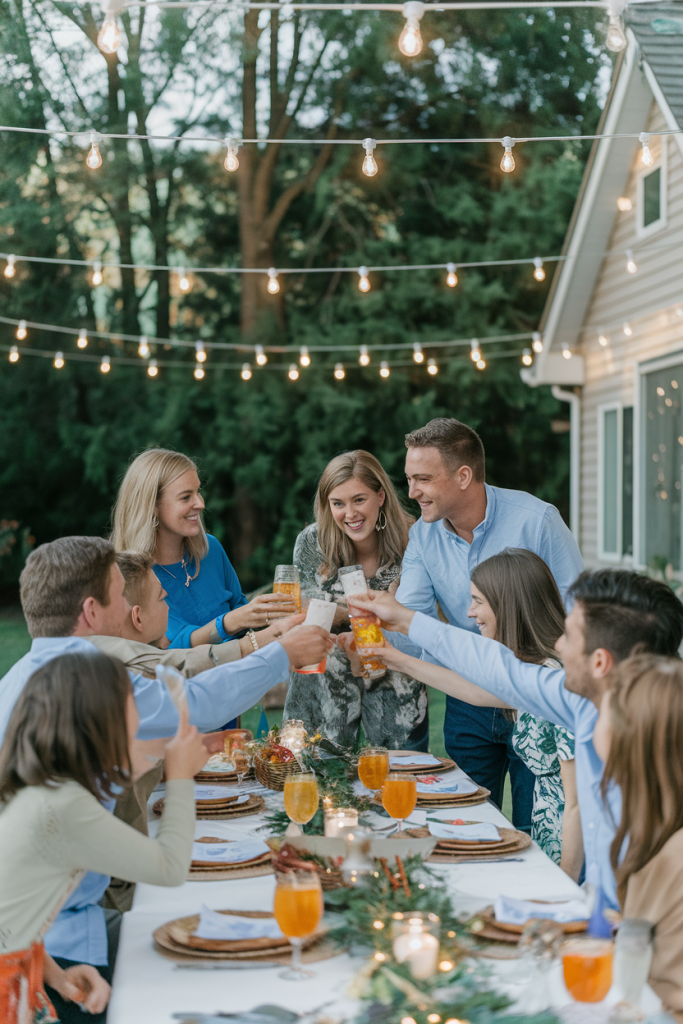  Family gathering celebrating an anniversary party outdoors